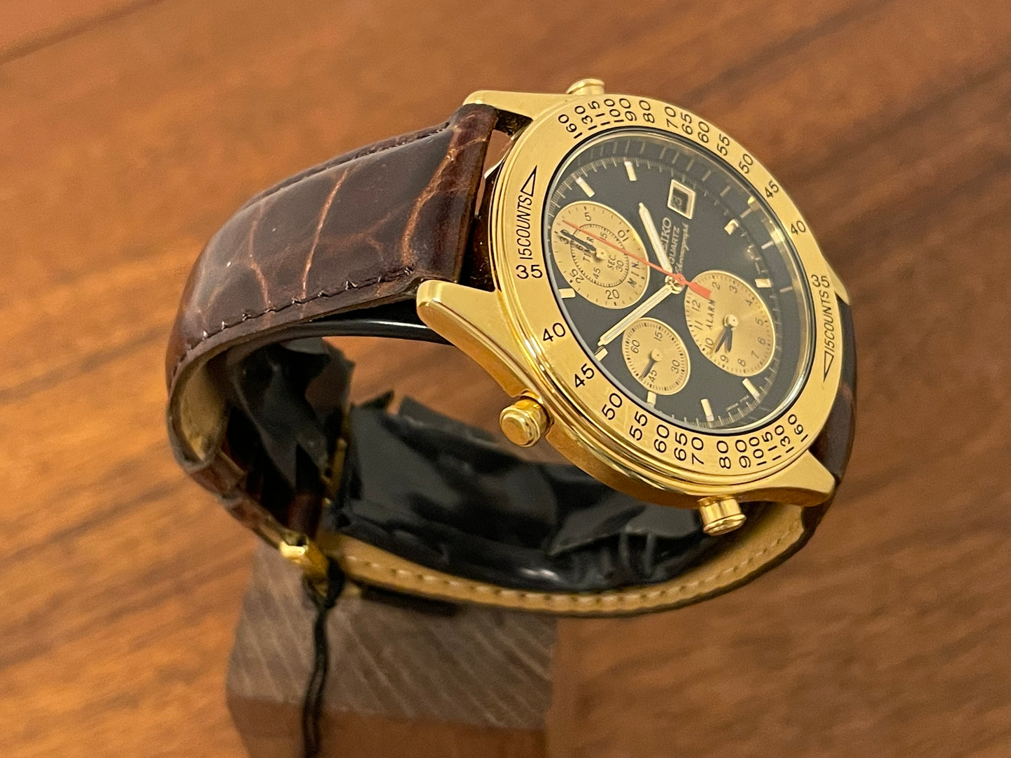 (1991) Seiko 7T42-7A4A “John Player Special” chronograph - gold case, black dial w/ gold markers (NOS)