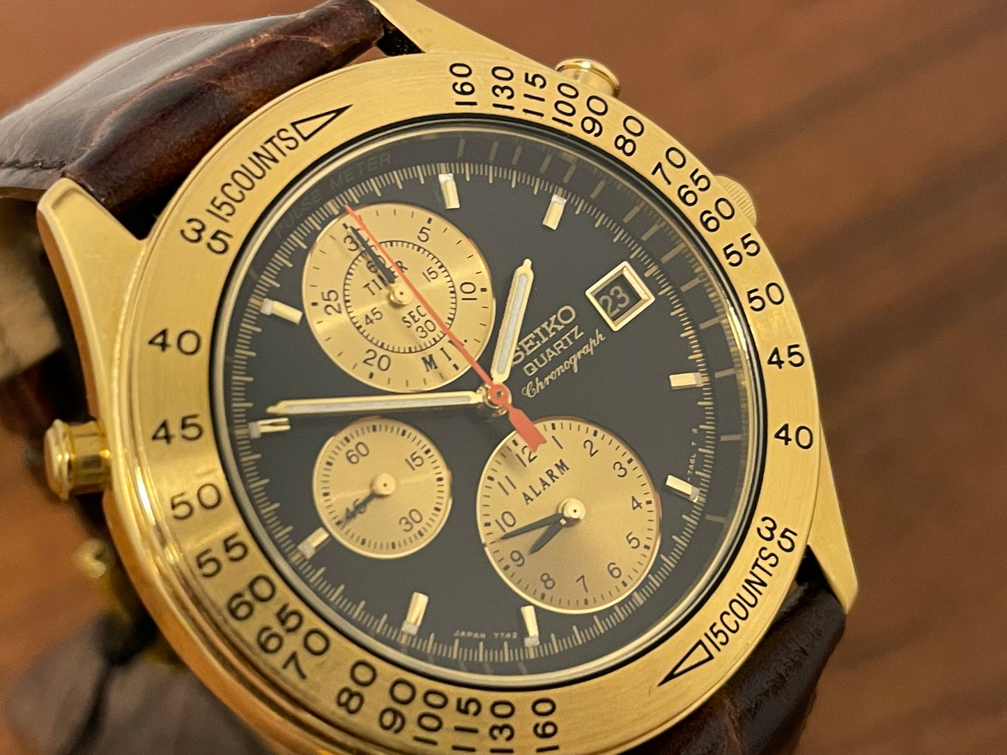 (1991) Seiko 7T42-7A4A “John Player Special” chronograph - gold case, black dial w/ gold markers (NOS)