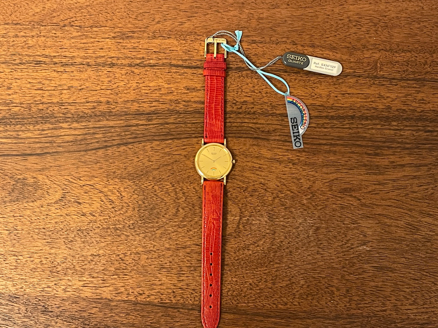 (2002) Seiko 4N00-0711 Quartz "Arcobaleno" dress watch - gold dial w/ rainbow logo - small size (NOS)