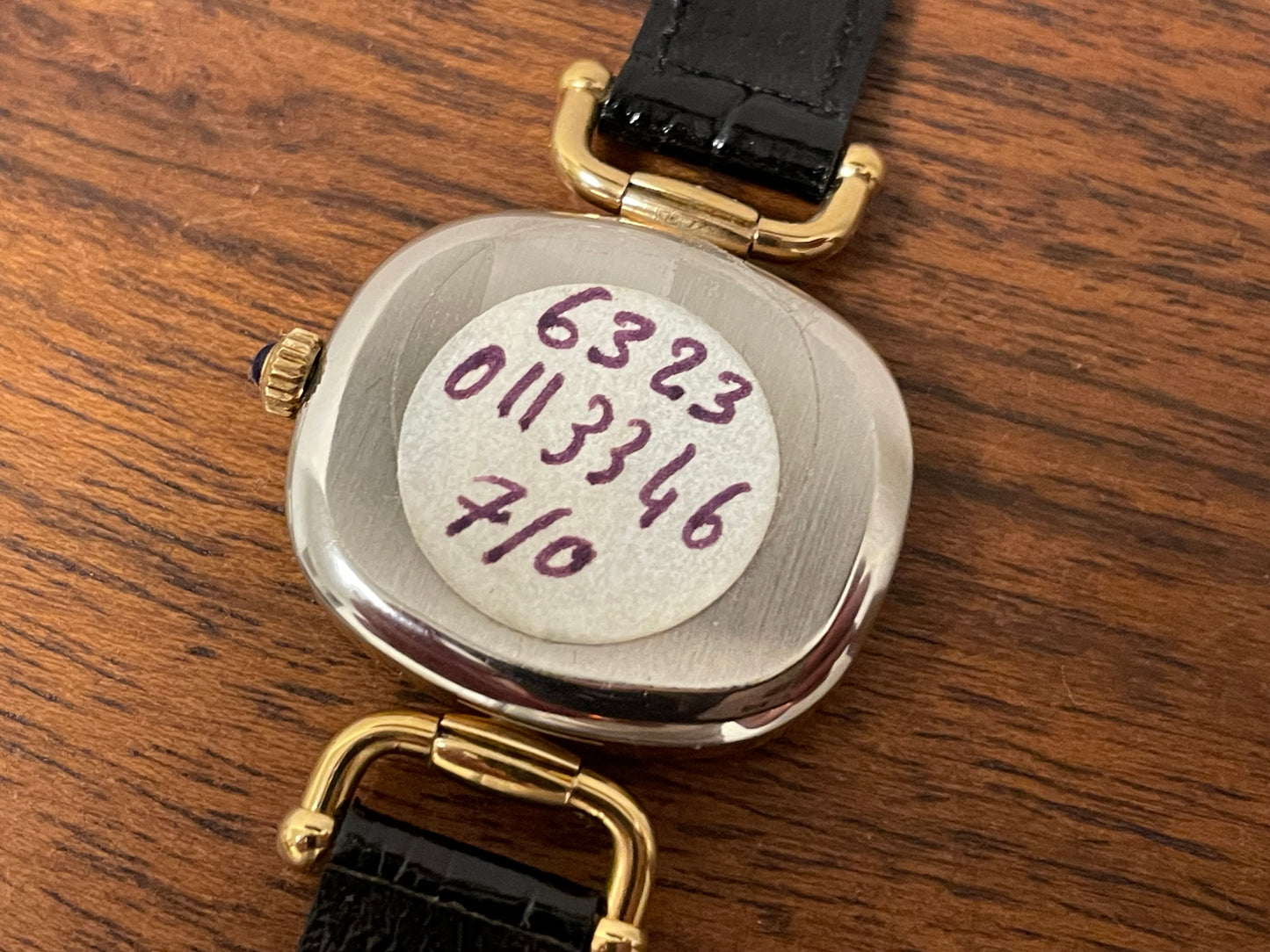 (1980s/1990s) Bulova Paris dress watch - cushion case - gold dial w/ black Roman numerals - small size (NOS)