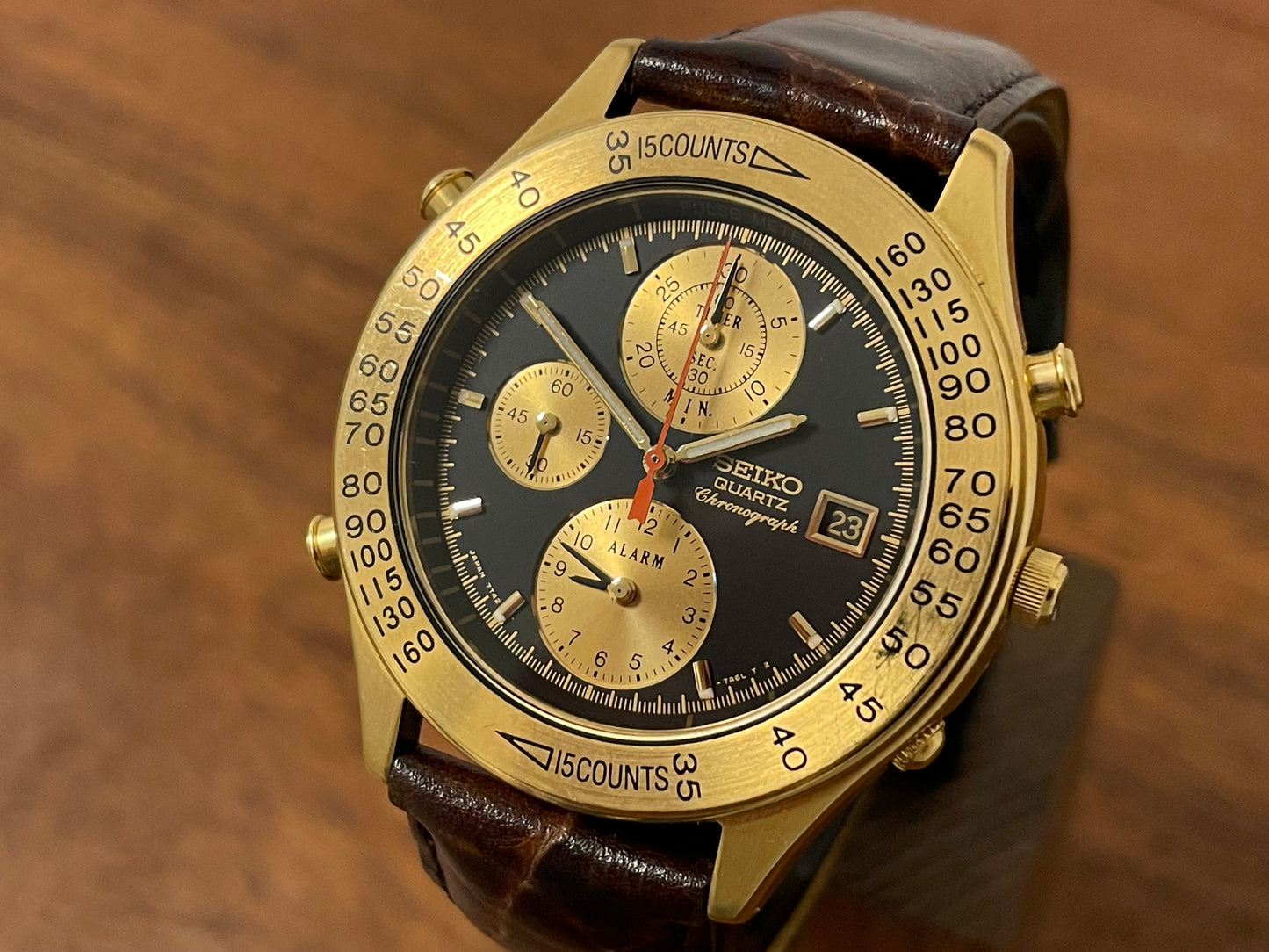 (1991) Seiko 7T42-7A4A “John Player Special” chronograph - gold case, black dial w/ gold markers (NOS)