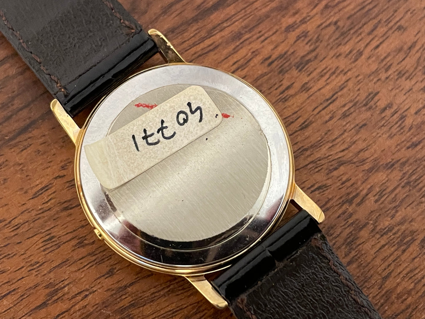 (1970s) Tissot 40771 Stylist dress watch - gold case - brushed gold dial w/ black Roman numerals (NOS)