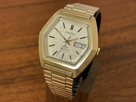 (1984) Seiko 0903-5009 SQ 4004 gold - hexagon case & diamond dust dial" front view