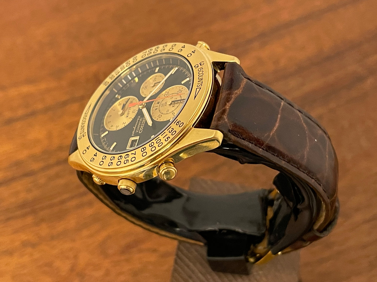 (1991) Seiko 7T42-7A4A “John Player Special” chronograph - gold case, black dial w/ gold markers (NOS)