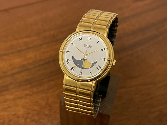 (1986) Seiko 7434-6070 gold colored dress watch - linen dial w/ moon phase