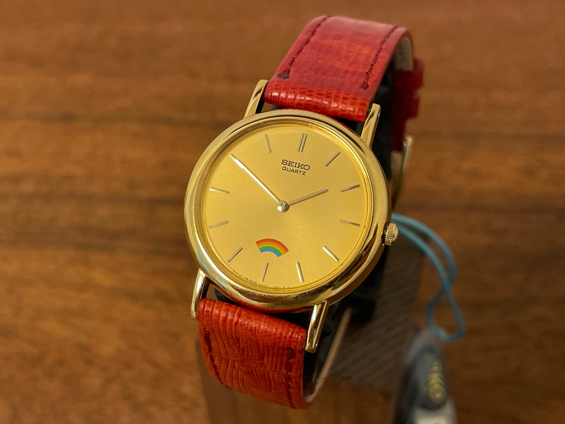 (1992) Seiko 4N00-0711 Quartz "Arcobaleno" dress watch - gold dial w/ rainbow logo - small size (NOS)