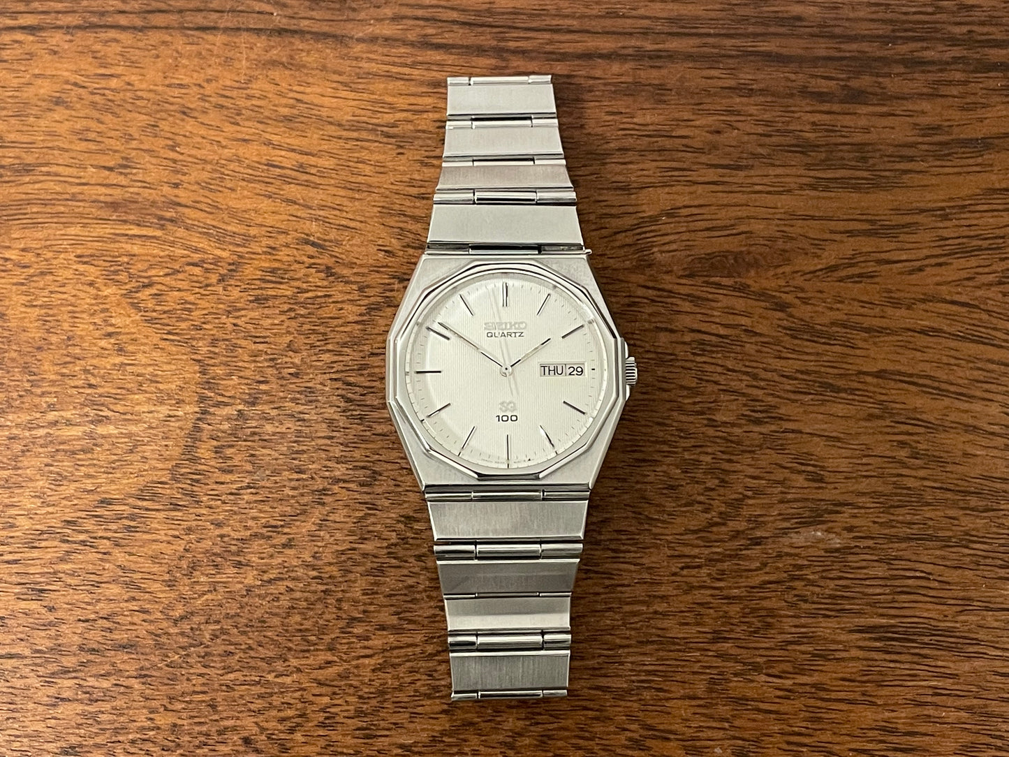 (1984) Seiko 6923-7080 Quartz SQ 100 dodecagon bezel - white waffle dial