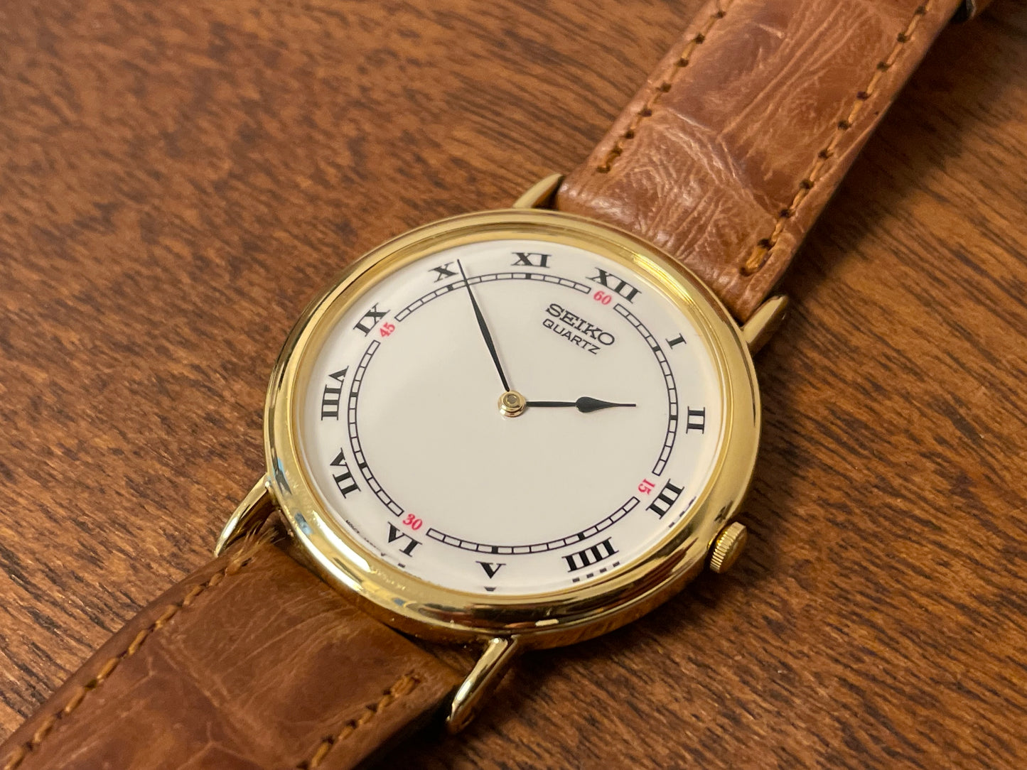 (1992) Seiko 7N00-6A00 dress watch - white dial w/ Roman numerals & Spade hands (NOS)