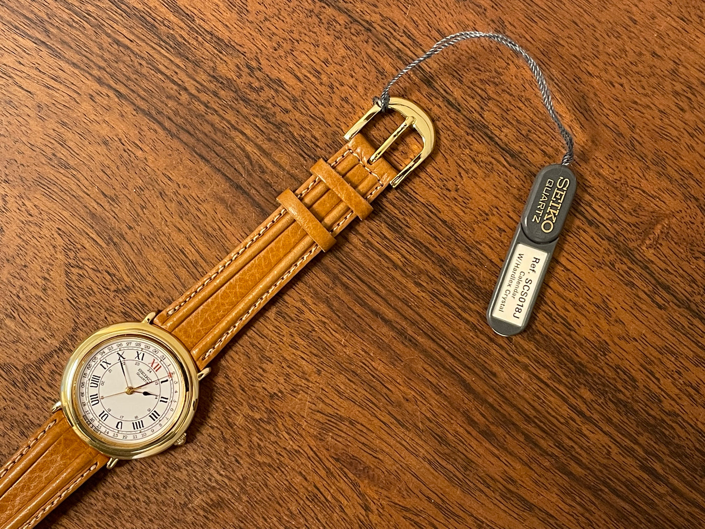 (1989) Seiko 6F25-6040 Quartz pointer date - white dial w/ Roman numerals (NOS)