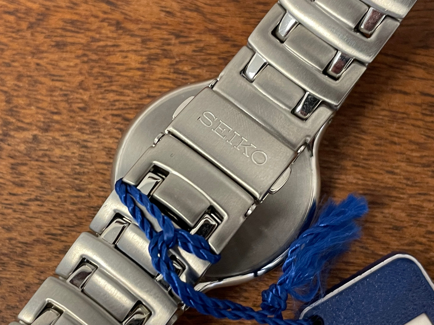 (1999) Seiko V732-0M50 - integrated bracelet - dark grey sunburst dial w/ silver markers (NOS)
