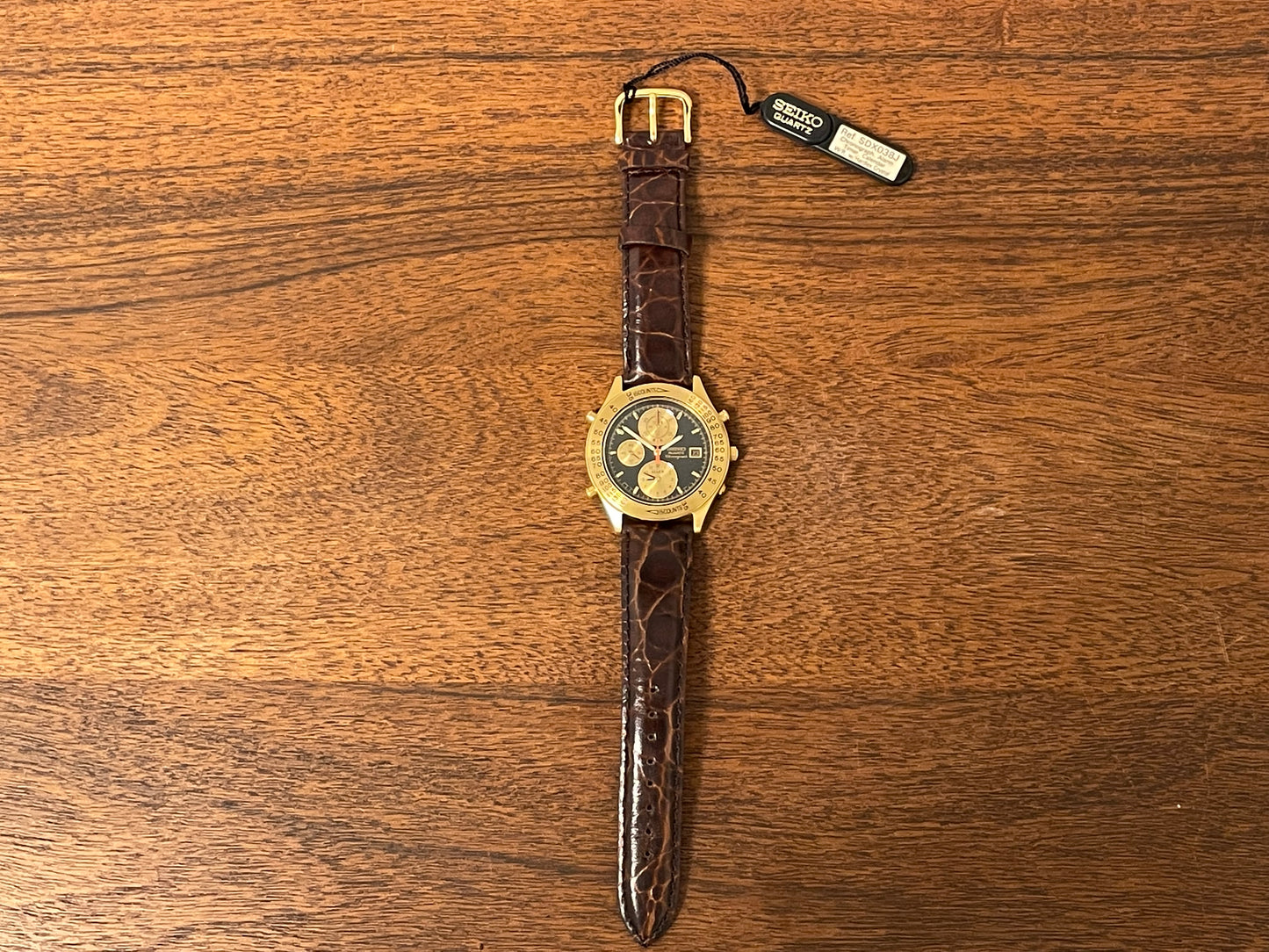(1991) Seiko 7T42-7A4A “John Player Special” chronograph - gold case, black dial w/ gold markers (NOS)