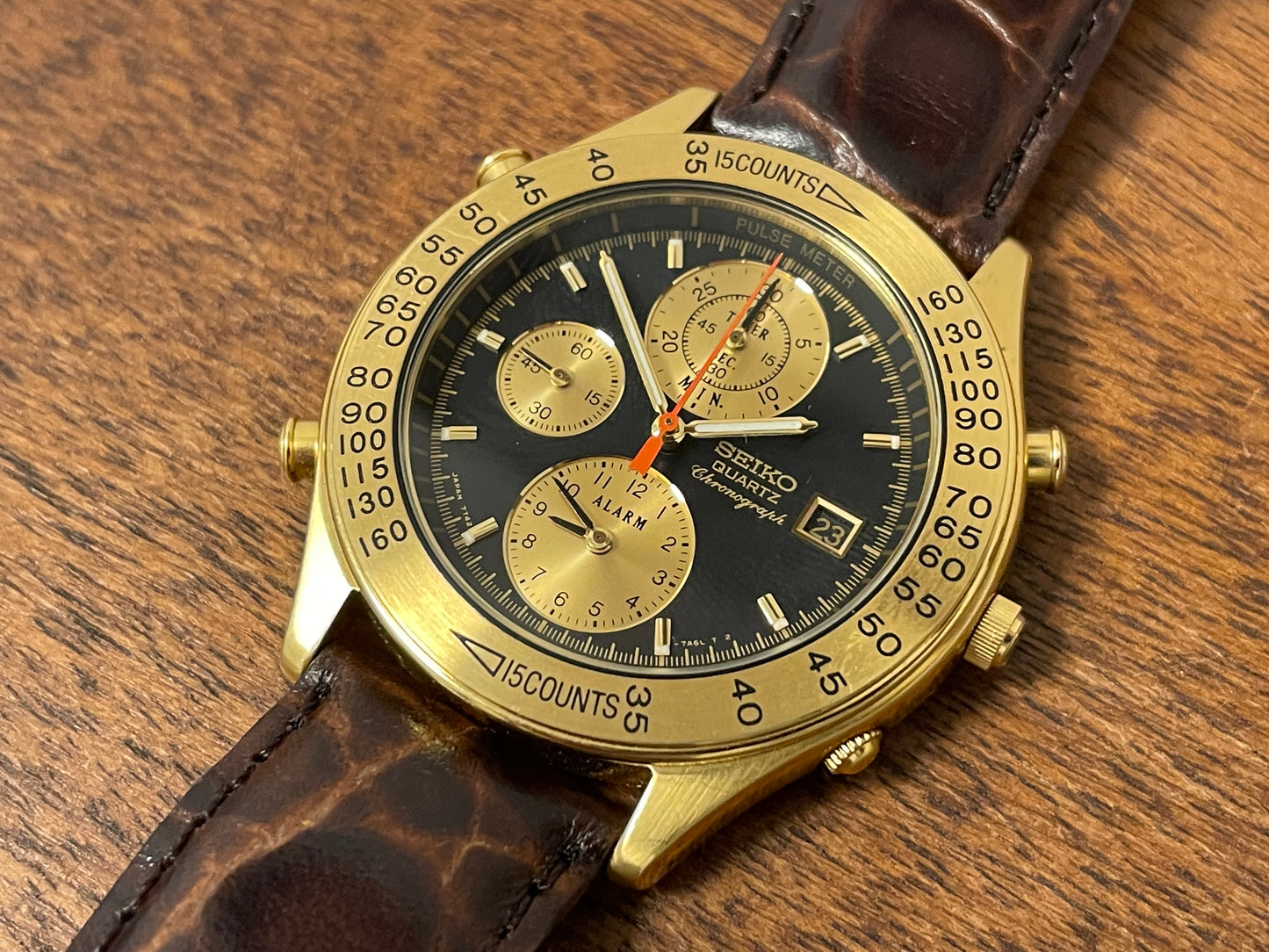 (1991) Seiko 7T42-7A4A “John Player Special” chronograph - gold case, black dial w/ gold markers (NOS)