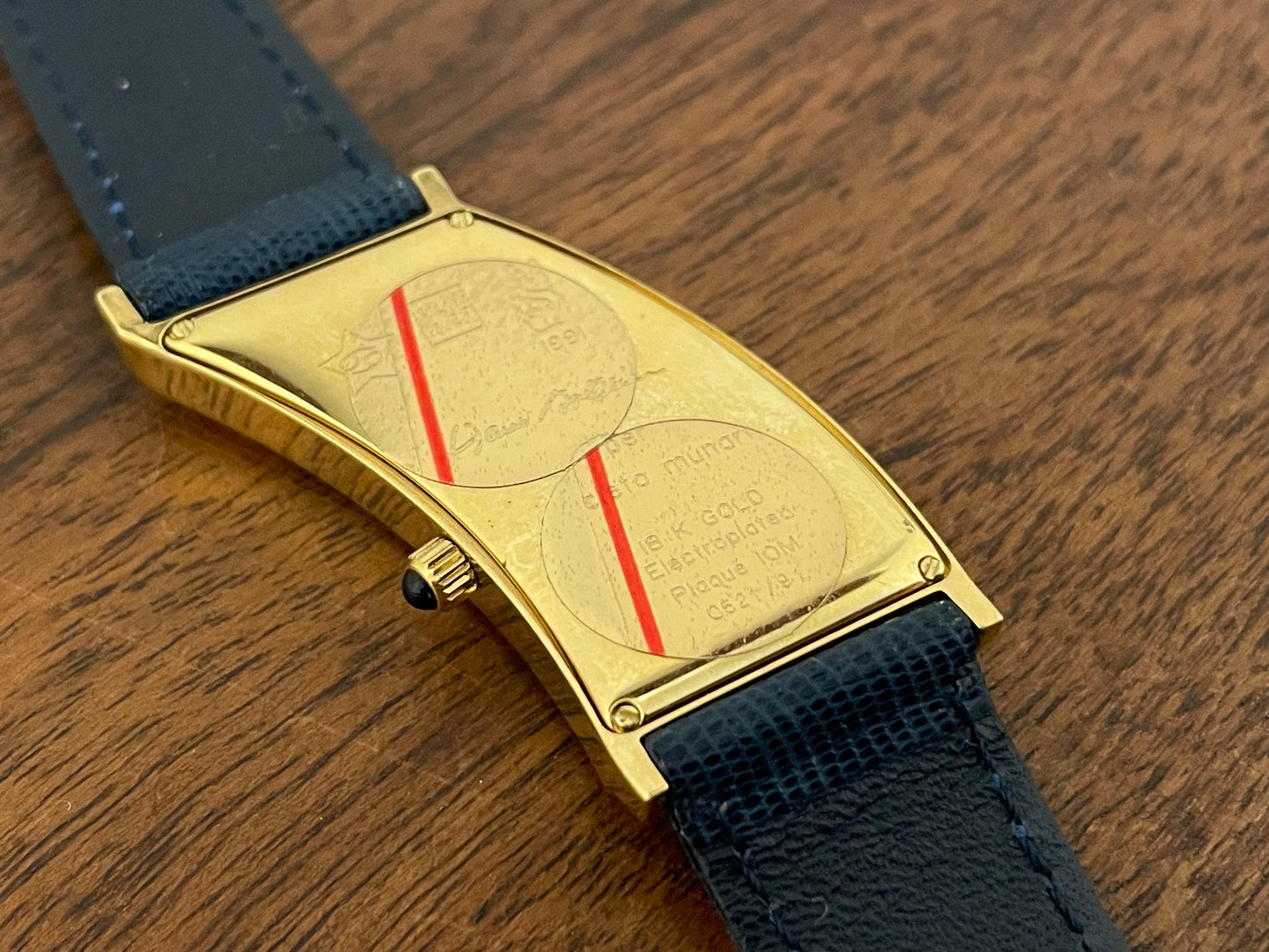(1991) Cleto Munari "Parentesi" by Hans Hollein - asymmetrical 18K gold electroplated case - blue enamel dial (NOS + full set)