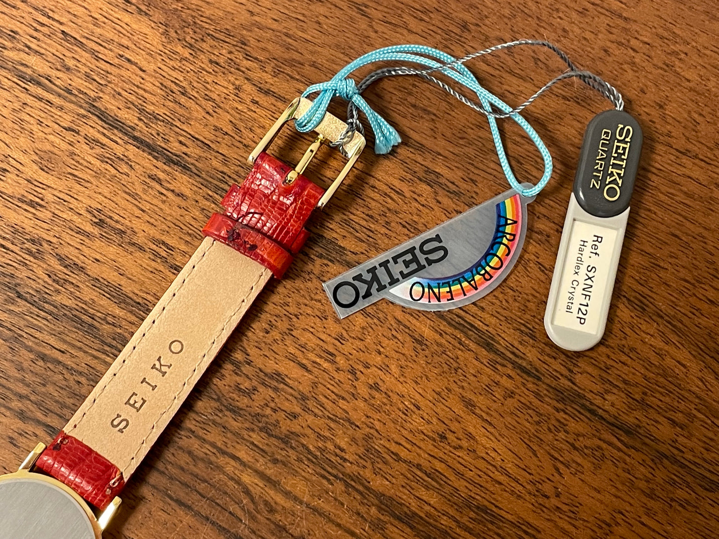 (2002) Seiko 4N00-0711 Quartz "Arcobaleno" dress watch - gold dial w/ rainbow logo - small size (NOS)