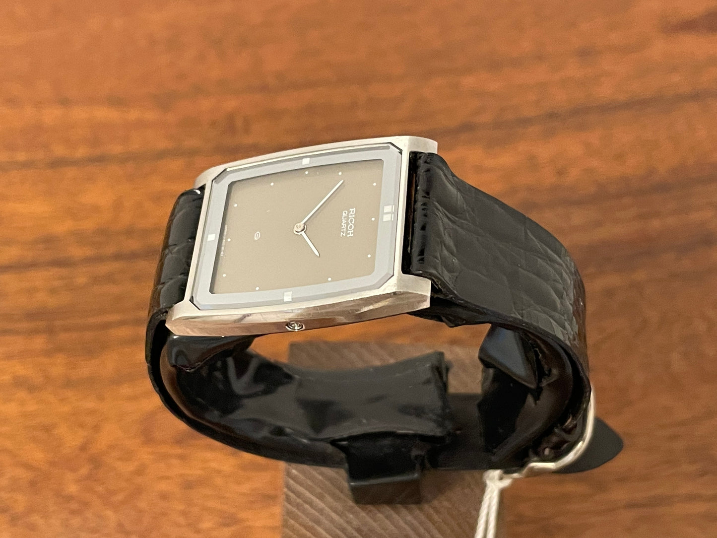 (1970s/1980s) Ricoh 632042 Riquartz "Tank" dress watch - flat taupe dial w/ white markers (NOS)