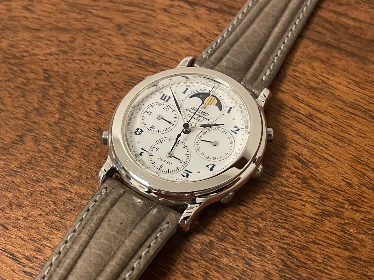 (1991) Seiko 7T36-7A00 chronograph, moon phase & alarm - silver case w/ white dial (NOS)