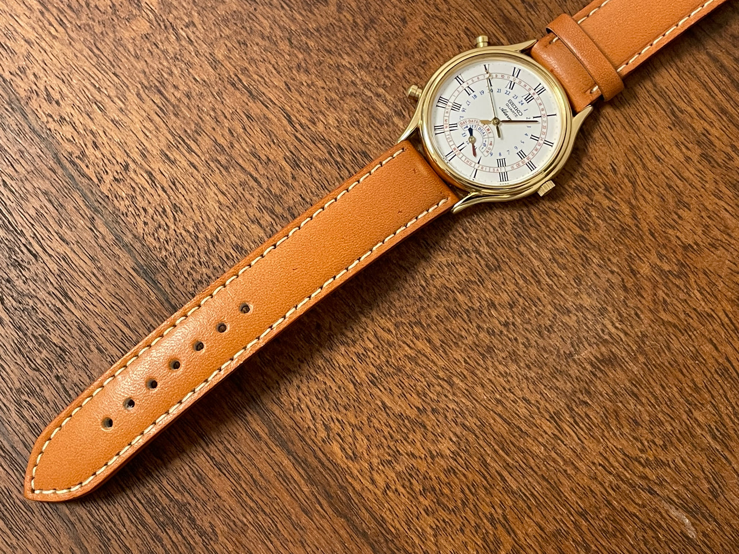 (1999) Seiko 8M15-9000 Quartz Alarm " dancing hands" - gold case w/ white dial (NOS)