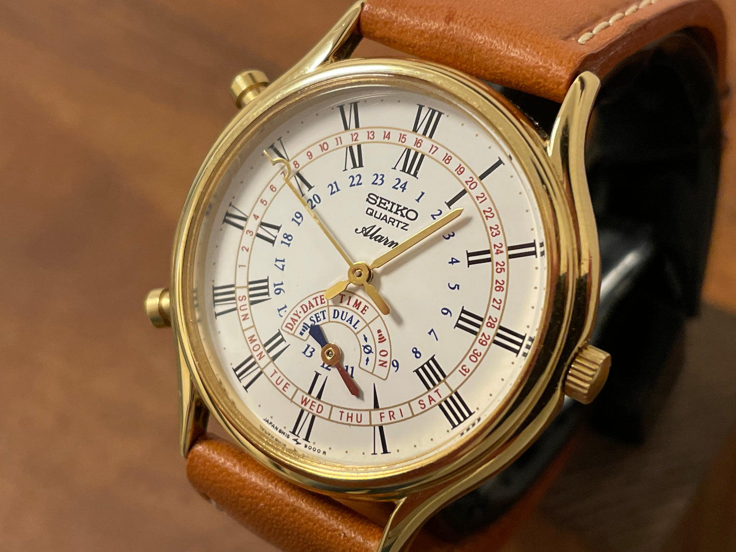 (1999) Seiko 8M15-9000 Quartz Alarm " dancing hands" - gold case w/ white dial (NOS)