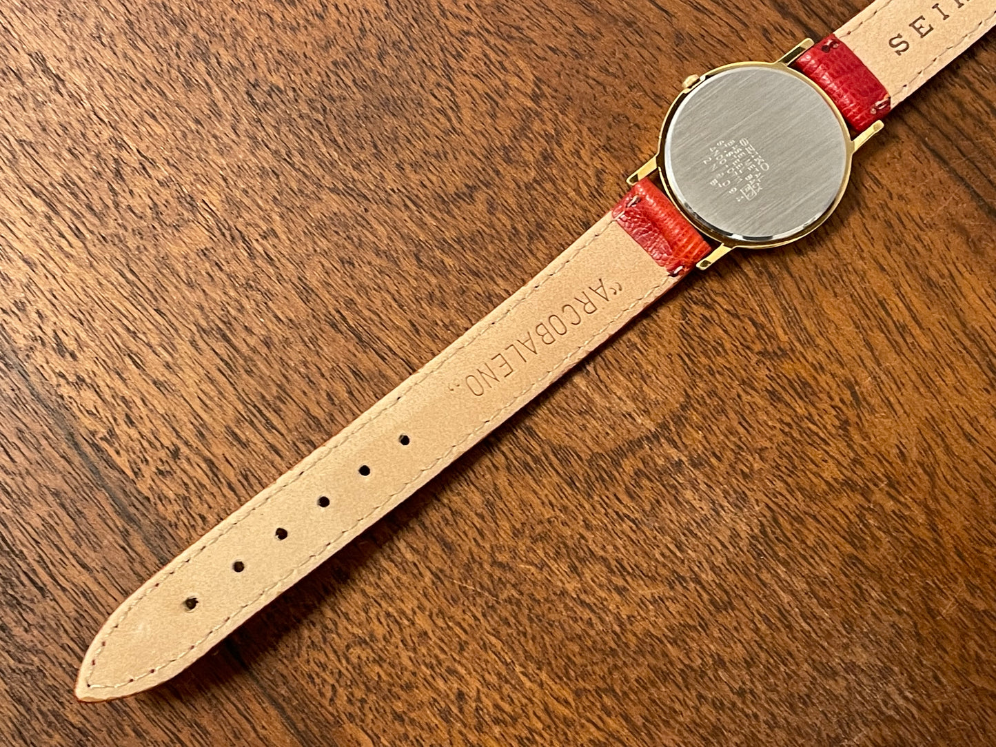 (2002) Seiko 4N00-0711 Quartz "Arcobaleno" dress watch - gold dial w/ rainbow logo - small size (NOS)