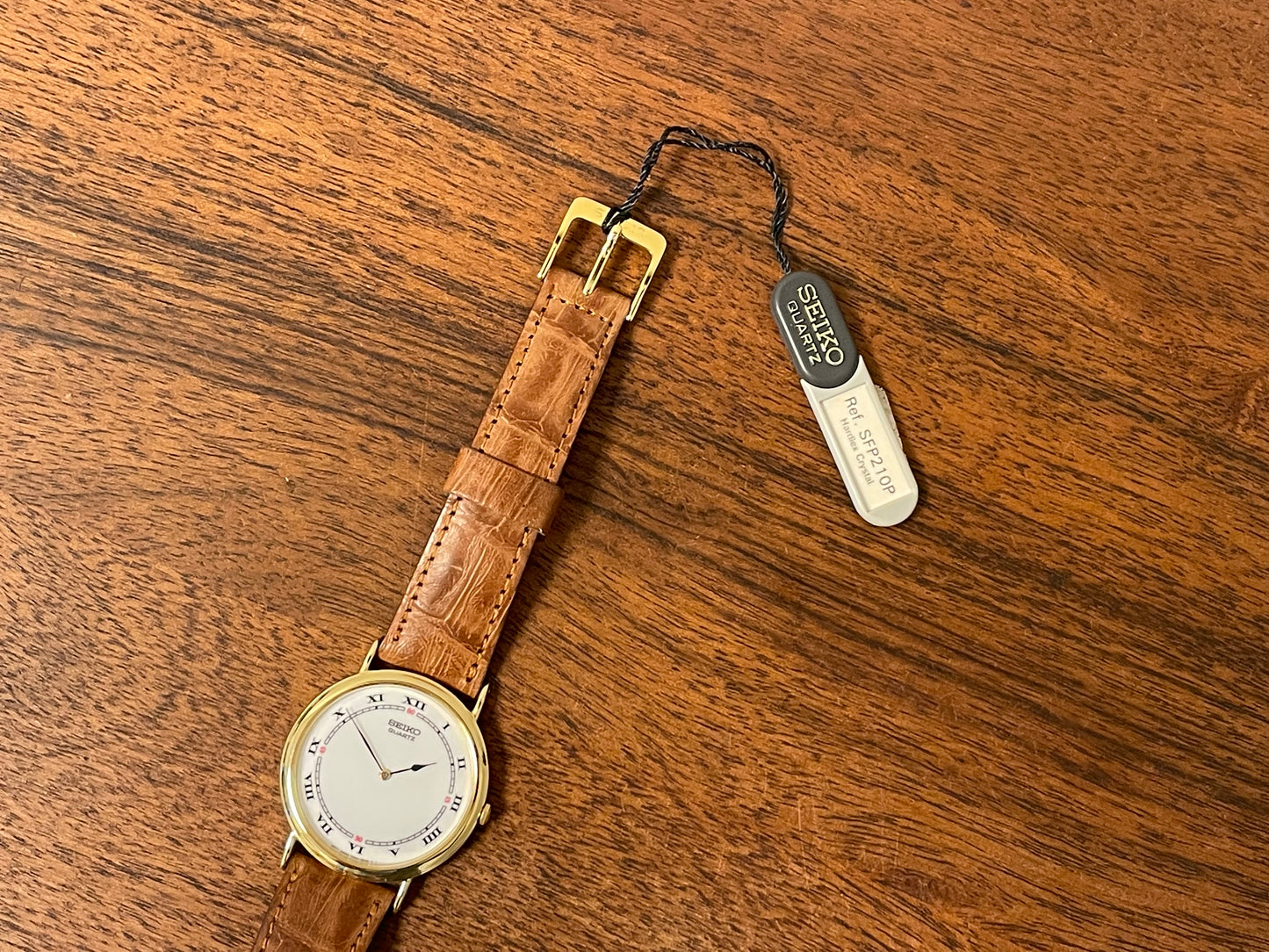 (1992) Seiko 7N00-6A00 dress watch - white dial w/ Roman numerals & Spade hands (NOS)