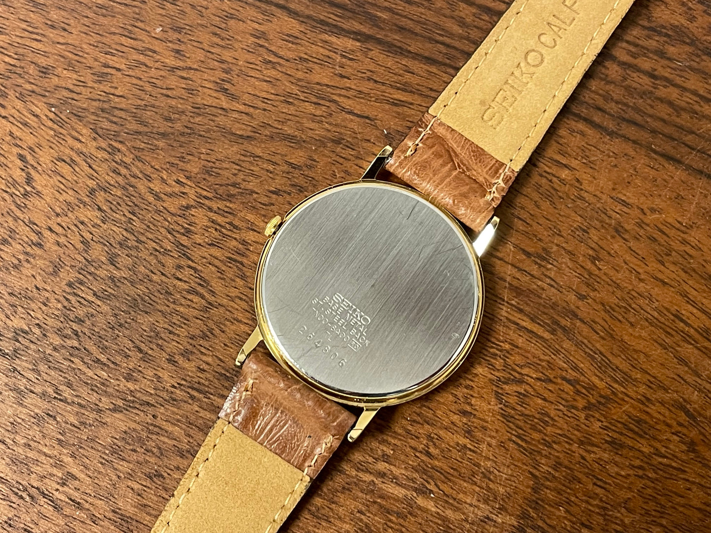 (1992) Seiko 7N00-6A00 dress watch - white dial w/ Roman numerals & Spade hands (NOS)