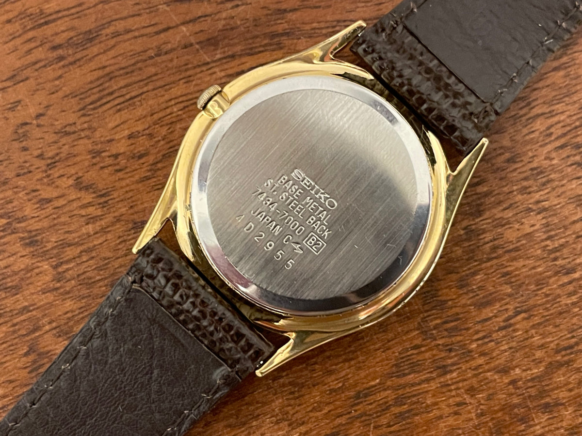 (1984) Seiko 7434-7000 dress watch - champagne dial w/ moonphase & stick markers