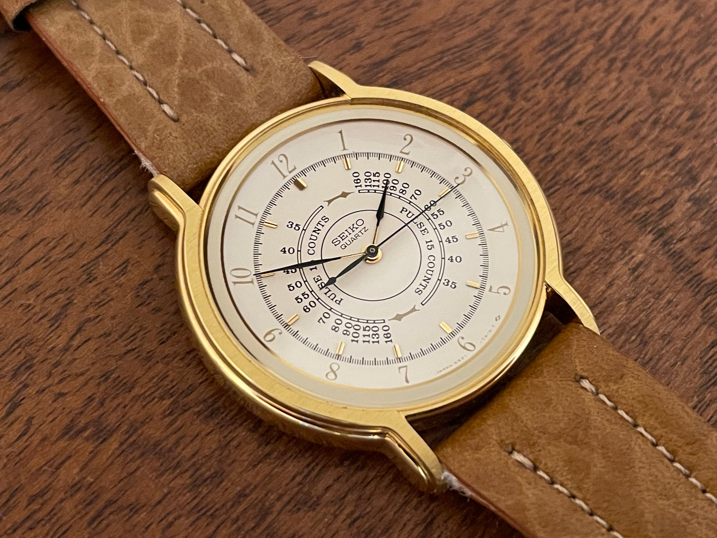 (1989) Seiko 5S21-7A10 Quartz medial pulsation - cream dial w/ gold Arabic numerals (NOS)