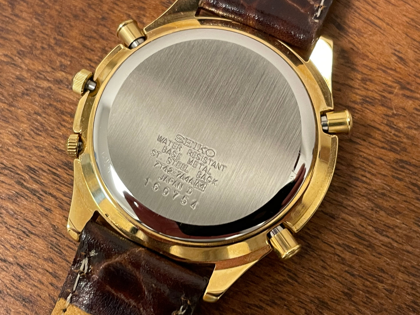 (1991) Seiko 7T42-7A4A “John Player Special” chronograph - gold case, black dial w/ gold markers (NOS)