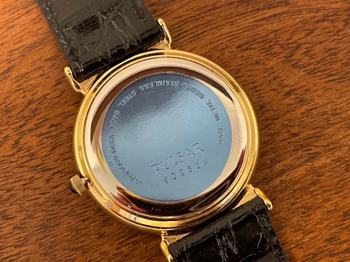 (1999) Pulsar V339-6000 world Timer - gold case - rotating white dial w/ gold markers (NOS)