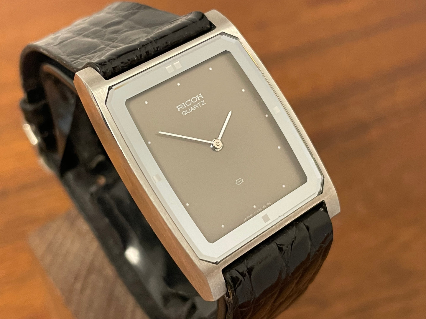 (1970s/1980s) Ricoh 632042 Riquartz "Tank" dress watch - flat taupe dial w/ white markers (NOS)
