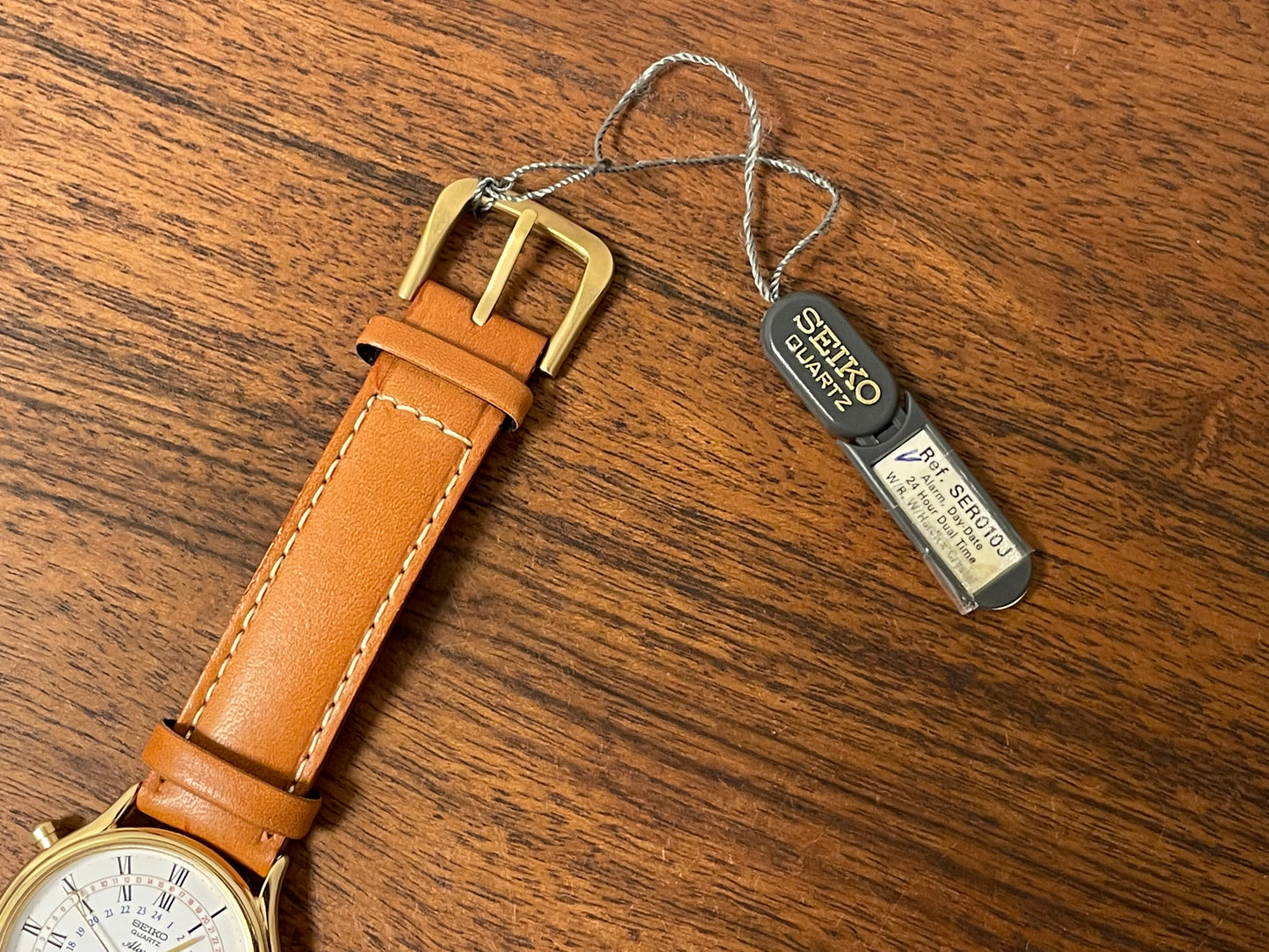 (1999) Seiko 8M15-9000 Quartz Alarm " dancing hands" - gold case w/ white dial (NOS)