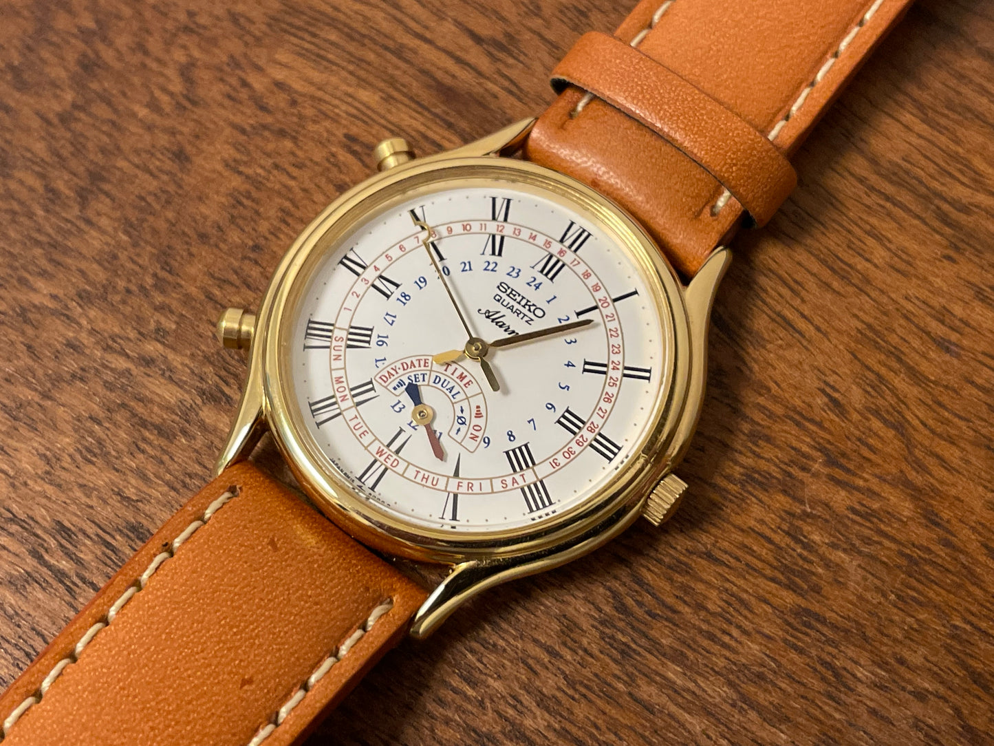 (1999) Seiko 8M15-9000 Quartz Alarm " dancing hands" - gold case w/ white dial (NOS)