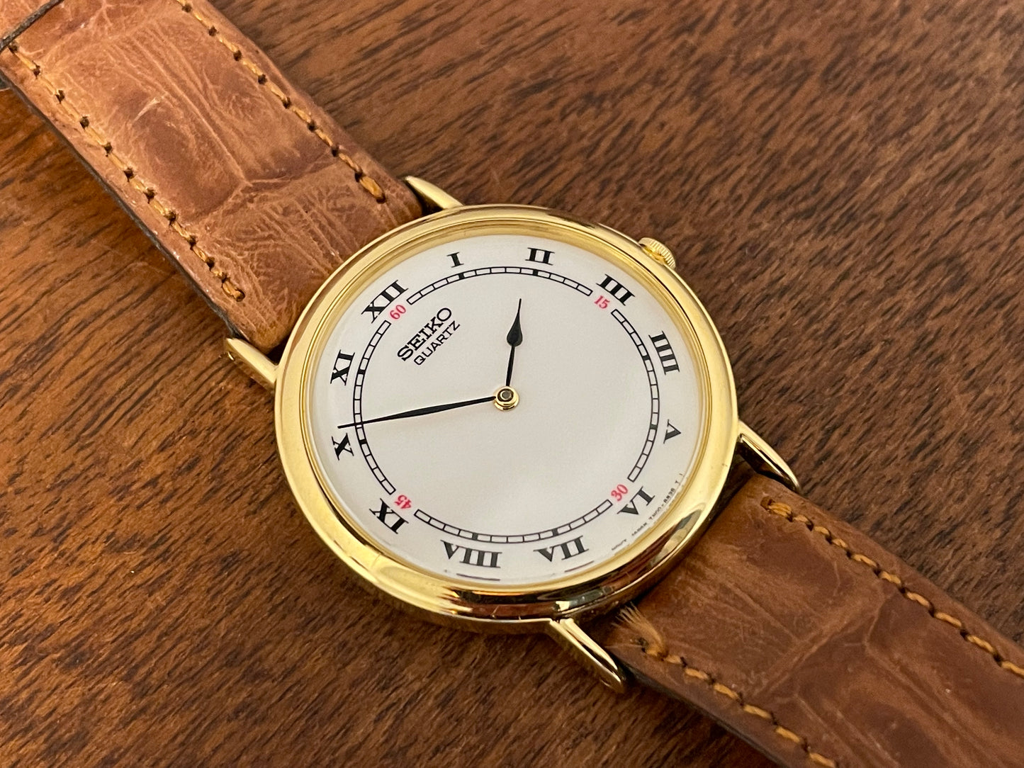 (1992) Seiko 7N00-6A00 dress watch - white dial w/ Roman numerals & Spade hands (NOS)