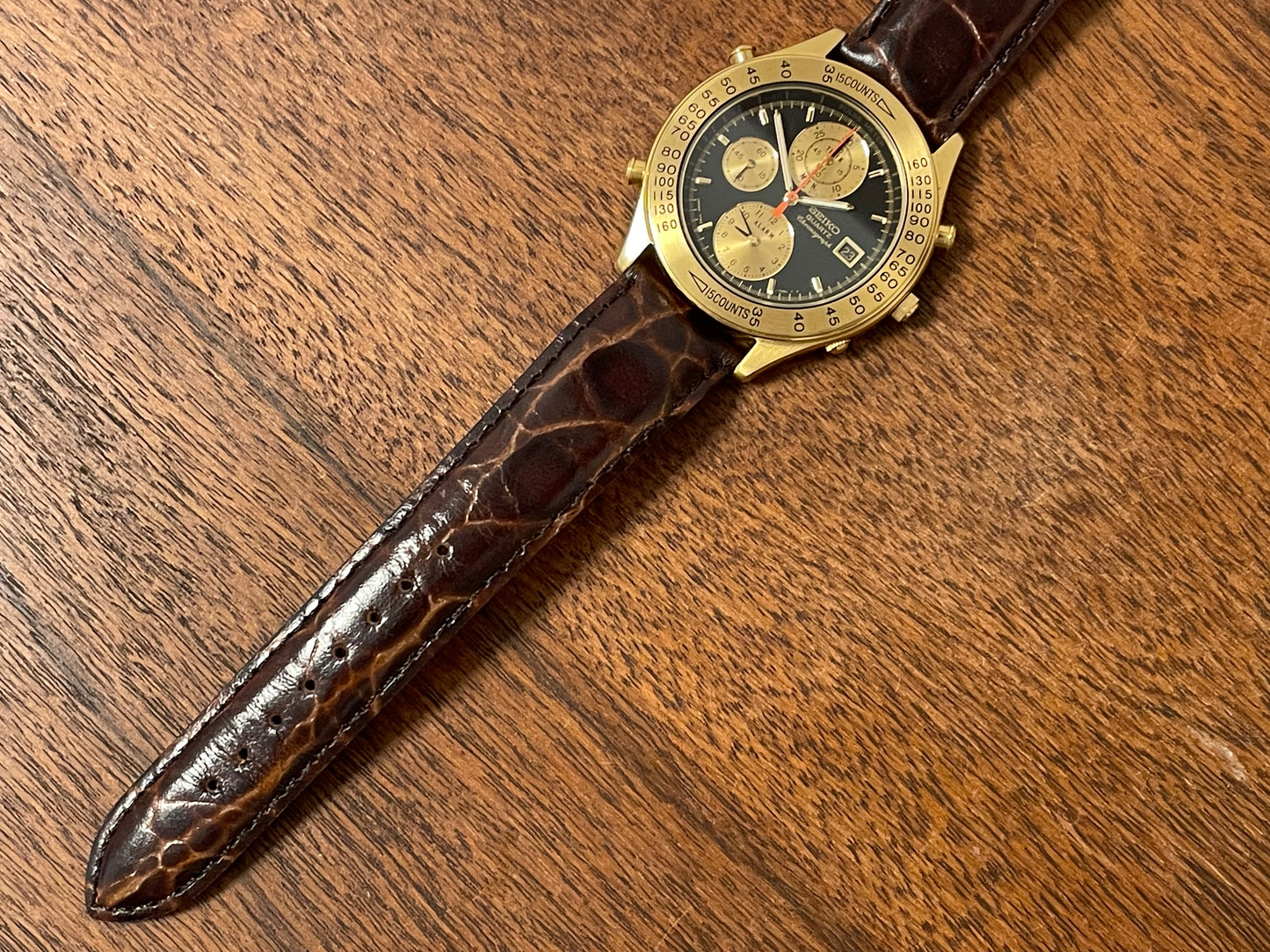 (1991) Seiko 7T42-7A4A “John Player Special” chronograph - gold case, black dial w/ gold markers (NOS)