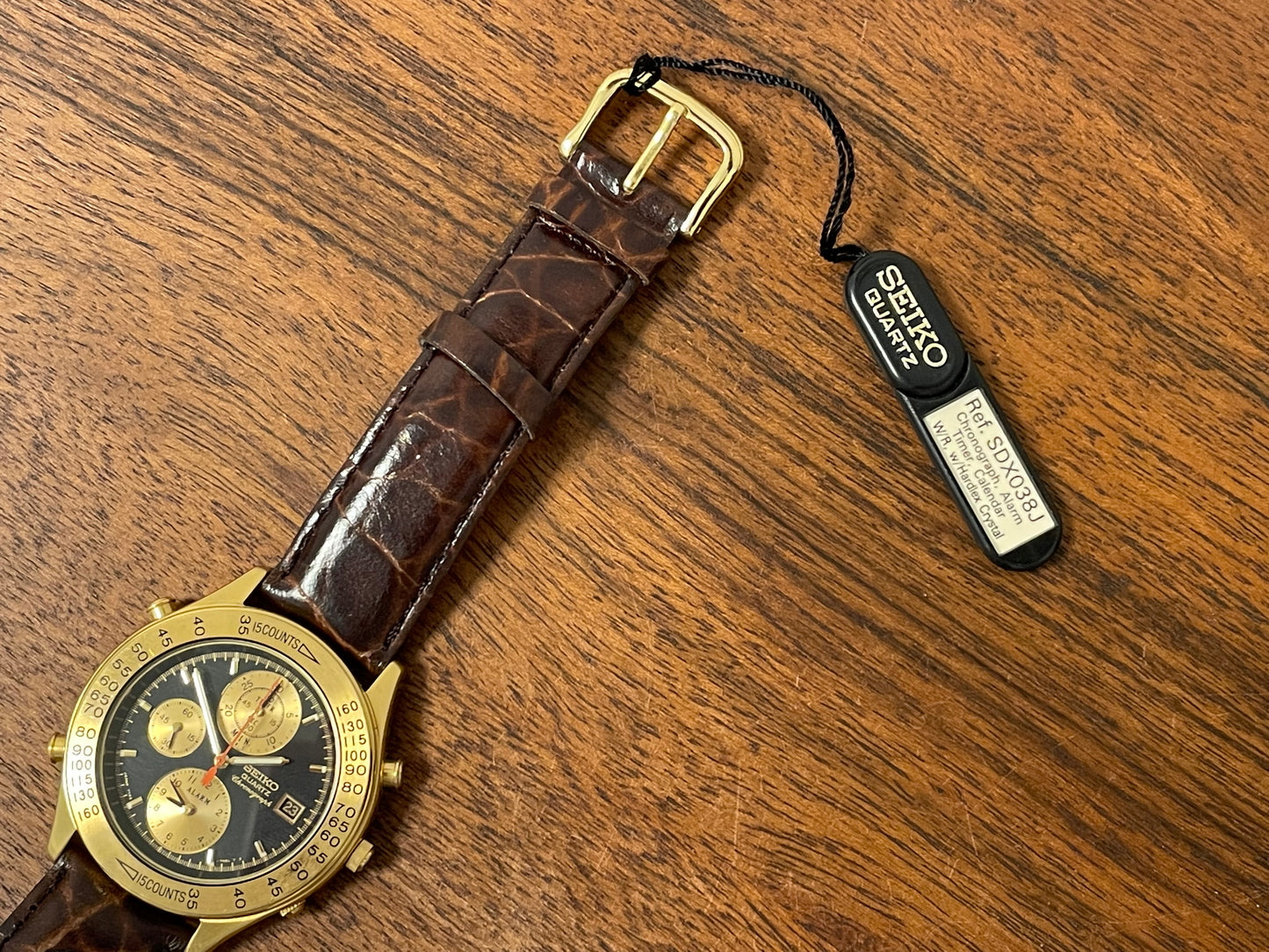(1991) Seiko 7T42-7A4A “John Player Special” chronograph - gold case, black dial w/ gold markers (NOS)