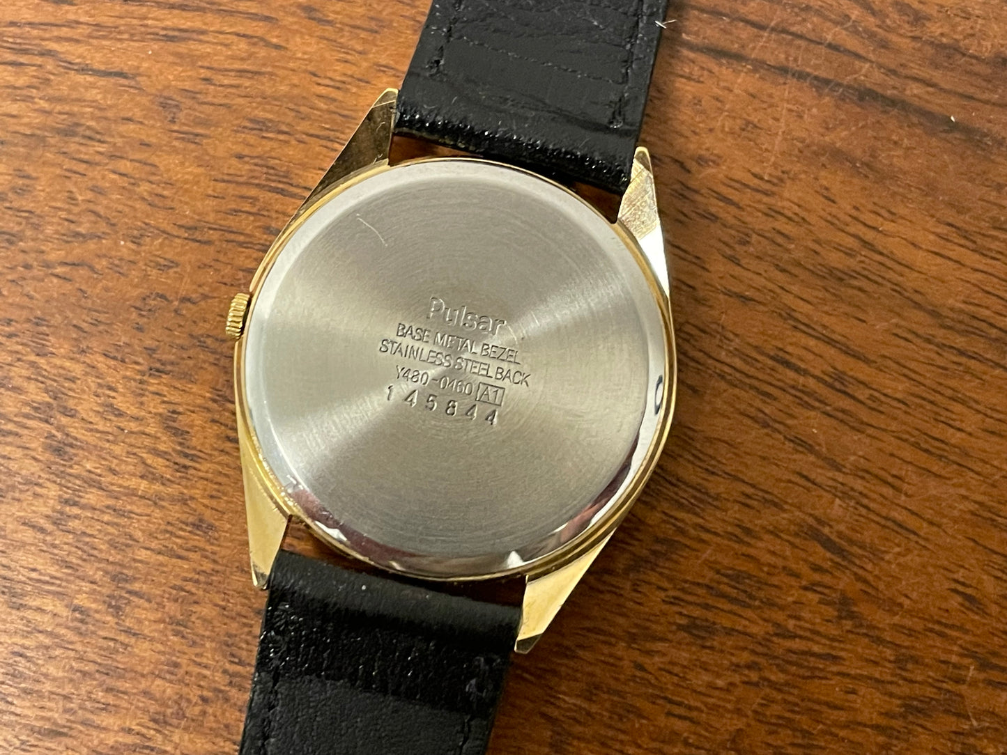 (1991) Pulsar Y480-0460 dress watch - gold colored case - matt champagne dial w/ black Arabic numerals - (NOS)