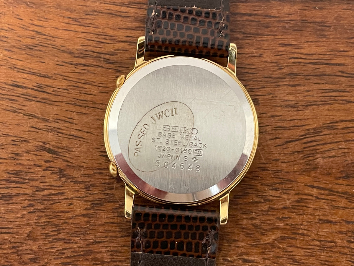 (1985) Seiko 1E20-0160 dual time dress watch - round case - gold textured dial w/ 2 subdials