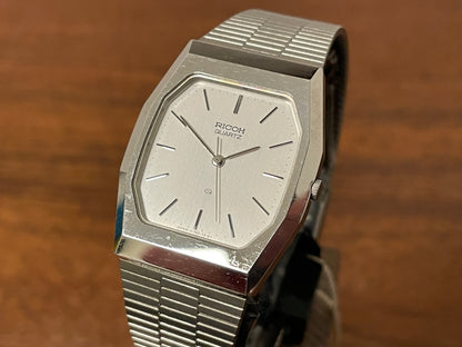 (1977) Ricoh 702008SS dress watch - silver brushed dial w/ silver markers (NOS)