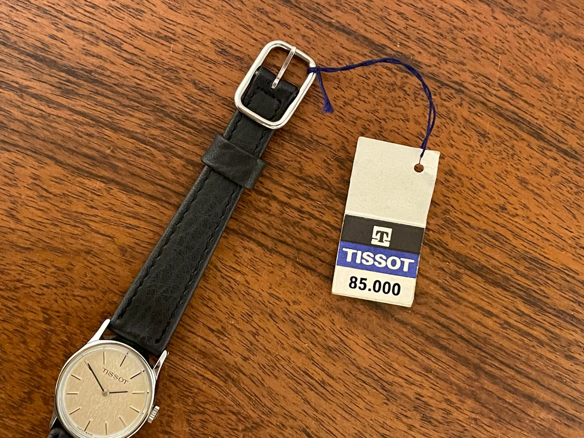 (1970s) Tissot 052-10991 Stylist dress watch - silver oval case - silverdust dial w/ silver stick markers - small size (NOS)