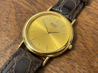 (2004) Seiko 7N00-6A70 dress watch -gold dial w/ gold markers - small size (NOS)