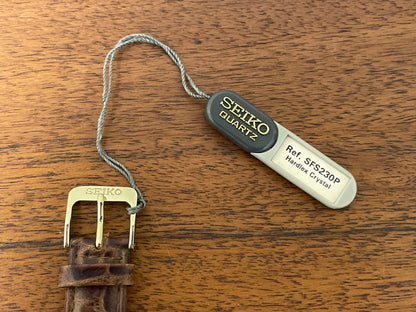 (2003) Seiko 7N01-7041 quartz dress watch - gold case w/ white dial & Arabic numerals (NOS)