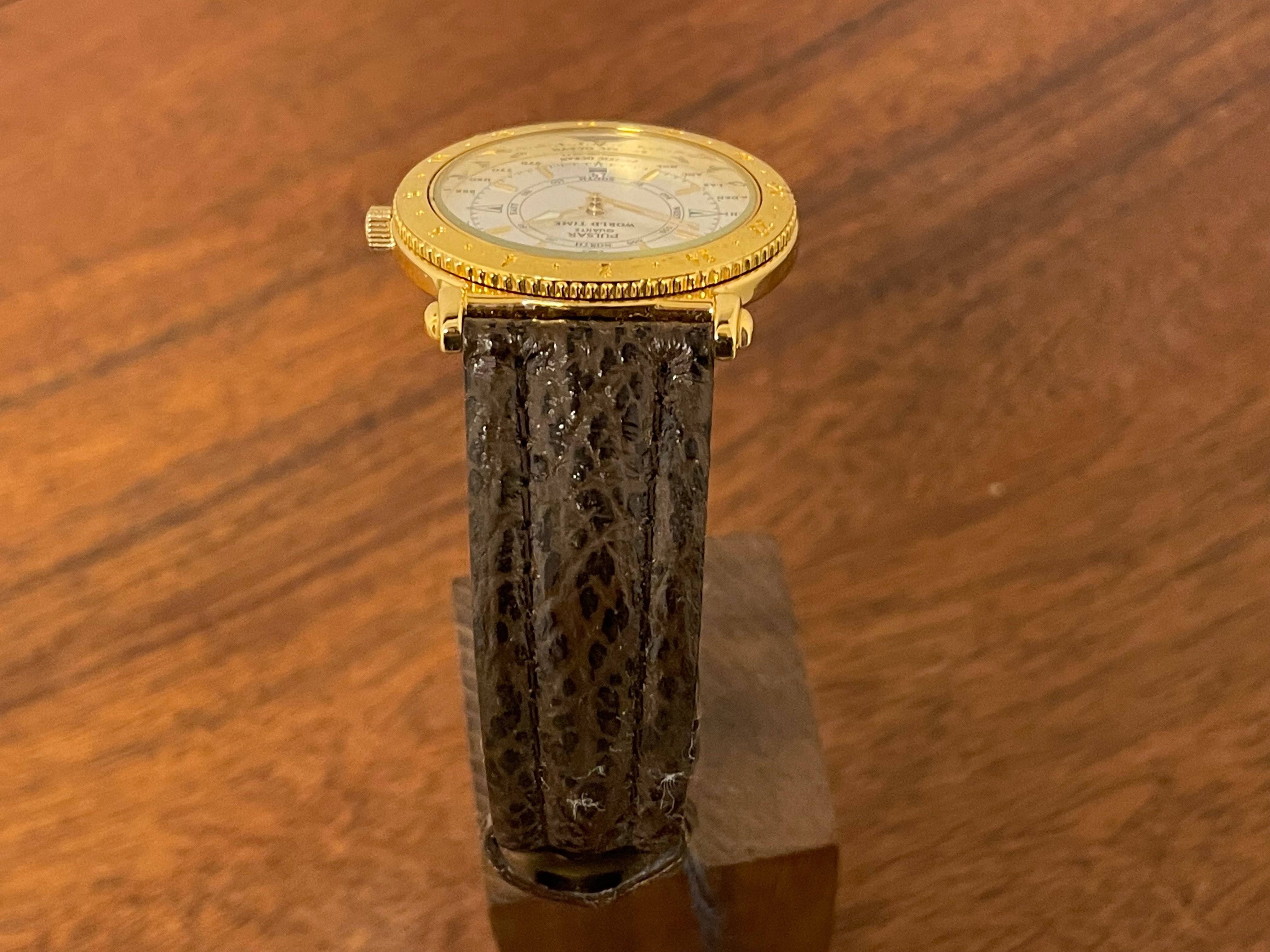 1992) Pulsar V722-7000 World Time - gold colored case - diamond