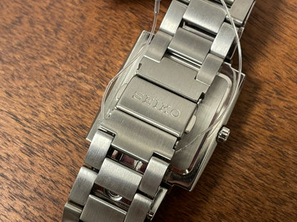 (2002) Seiko 7N32-5A30 - integrated bracelet - black dial w/ white Arabic numerals & markers (NOS)