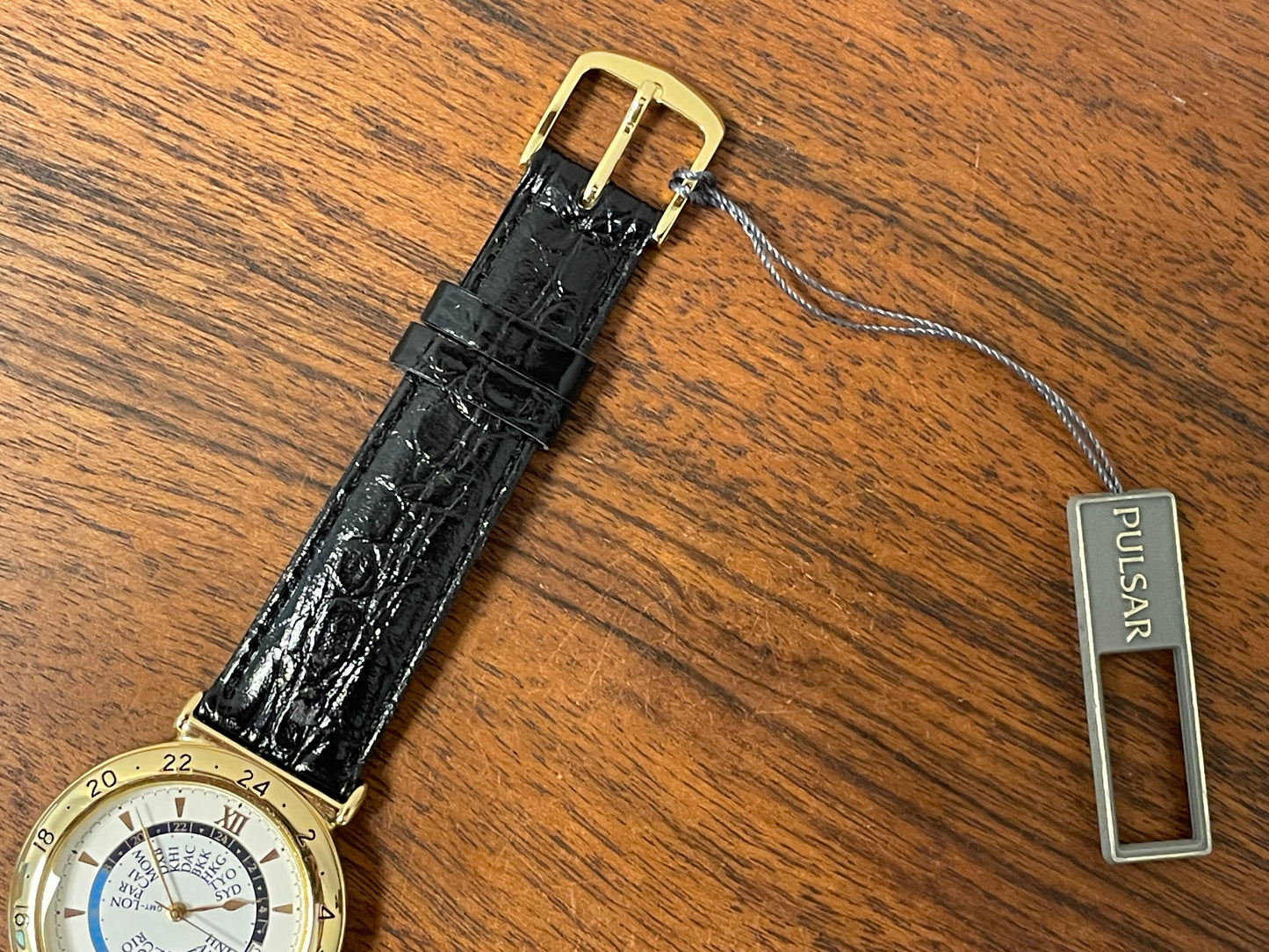 (1999) Pulsar V339-6000 world Timer - gold case - rotating white dial w/ gold markers (NOS)