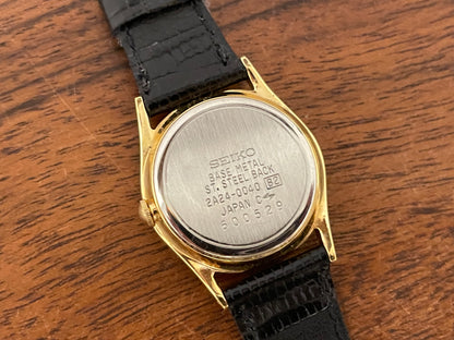 (1986) Seiko 2A24-0040 dress watch - white dial w/ moonphase & Roman numerals - small size (NOS)