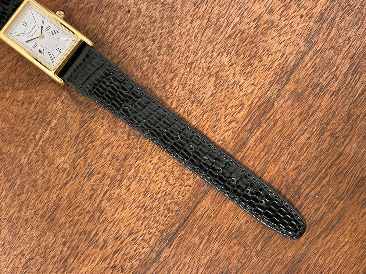 (1998) Tiffany & Co. Portfolio "Tank" dress watch - gold case - white dial w/ black Roman numerals (Mint)
