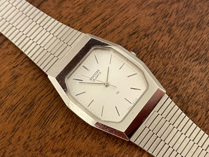 (1977) Ricoh 702008SS dress watch - silver brushed dial w/ silver markers (NOS)