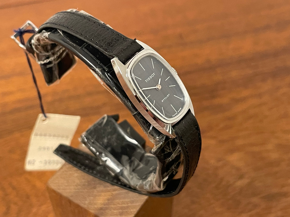 (1970s) Tissot HZ-10720 Stylist dress watch - silver tonneau case - blue brushed dial w/ silver stick markers - small size (NOS)