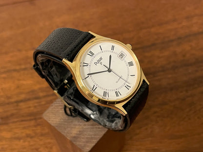 (1990) Pulsar Y552-8009 dress watch - gold colored case - white dial w/ black Roman numerals (NOS)
