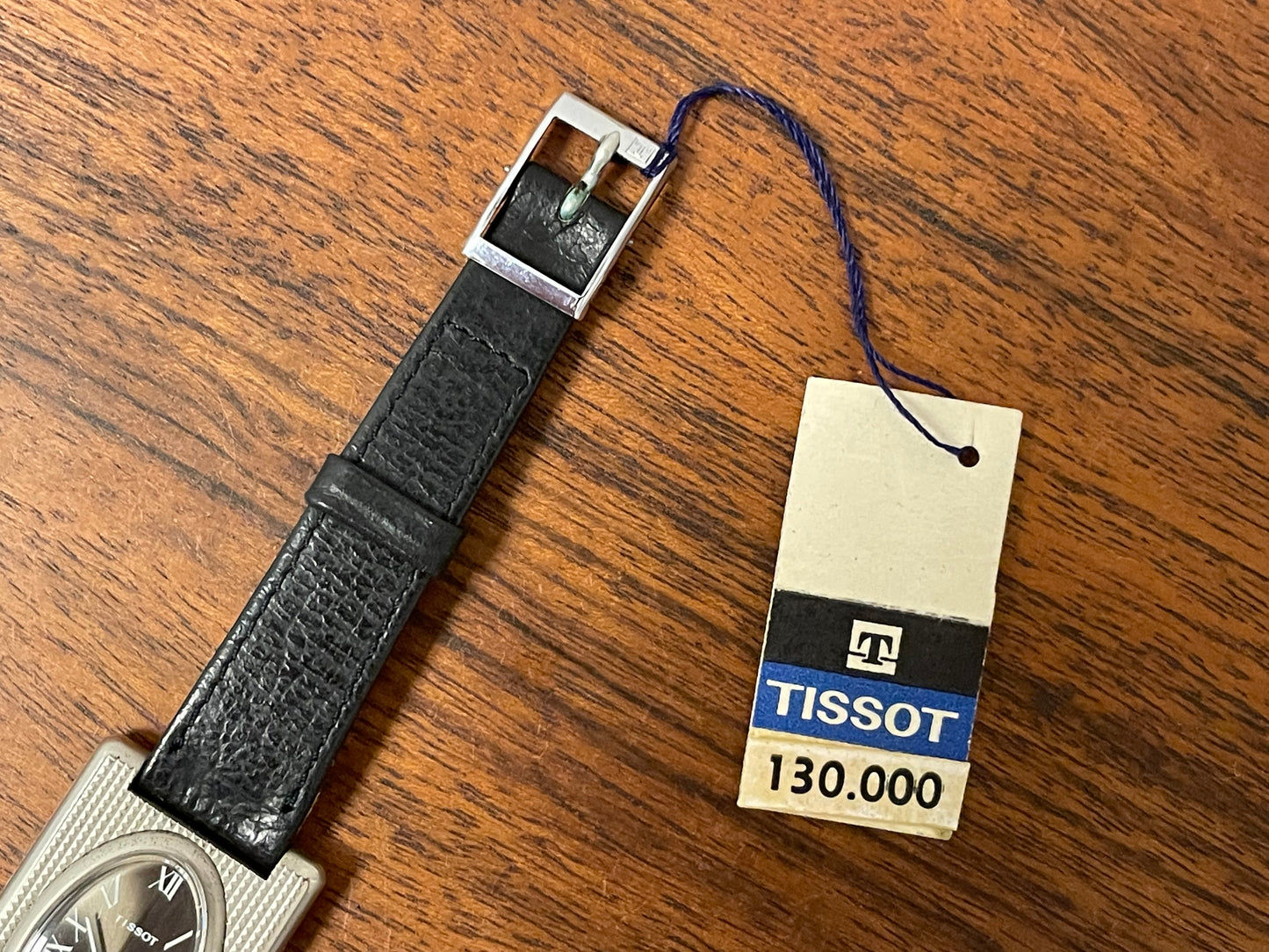 (1970s) Tissot Stylist "Tank" - decorated case - black sunburst dial w/ white Roman numerals - small size (NOS)